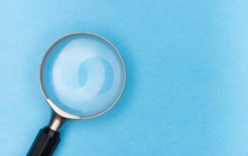 a magnifying glass on a blue background